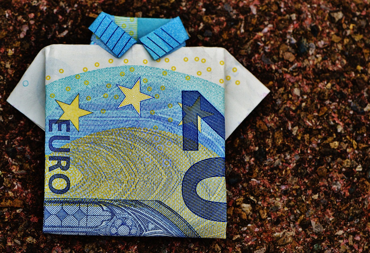 US currency in stacks — vig is the dollars-and-cents reality of every bet